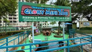a sign for a water park at a theme park at Beachfront Bliss Sea View Glory Beach PD Homestay in Port Dickson +46 photos