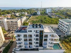 an aerial view of a building in a city at Valletta Homes- Modern 1BR, 5mins walk to Serena Beach in Mombasa