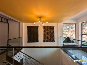 a house with a glass floor and a ceiling at Chic studio with amazing view in Yaoundé