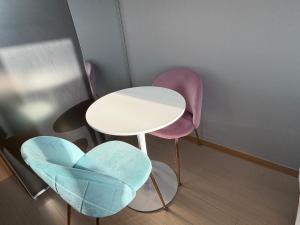 a room with two chairs and a table at Sky Star in Incheon
