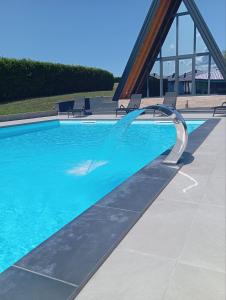 a swimming pool with a water fountain at Villa Rustic in Majetići
