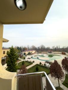 a balcony with a view of a park at Gabala Yeddi Gozel Hotel in Gabala