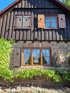 a house with windows on the side of it at Jagdhütte Breidelsley in Nideggen
