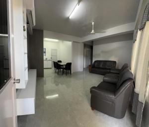 a living room with a couch and a table at 2 bedroom Flat in Namaka,Nadi in Nadi