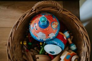 a basket full of toys on a table at Domaine La Commanderie in Boersch +12 photos