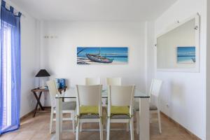 a dining room with a table and chairs at House Miramar almuñecar in Almuñécar