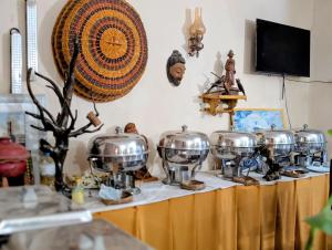 a group of pots on a counter in a room at Prasada Resort in Badulla