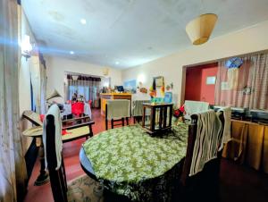 a living room with a table and a dining room at Prasada Resort in Badulla +25 photos