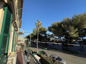 a balcony of a house with a car parked on the street at Casa Lungomare in Arenzano