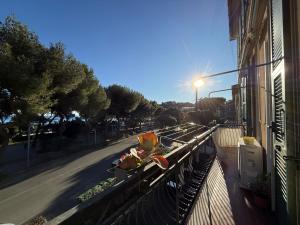 a balcony of a building with a light on a street at Casa Lungomare in Arenzano