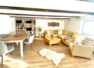 a living room with a couch and a table at Moosmühle Weitnau in Weitnau