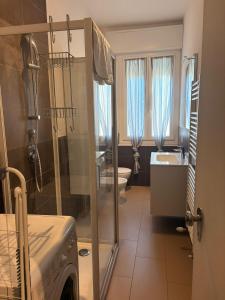 a bathroom with a shower and a sink and a toilet at GuestHouse Modena Buon Pastore in Modena +26 photos