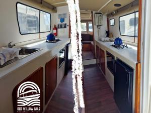 an rv kitchen with a sink and a counter at Old Willow Houseboats in Sasolburg