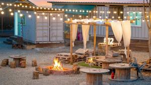 a backyard with a fire pit and a tent at GaPyeong Yeoldudal Spapension&Camping in Gapyeong +75 photos