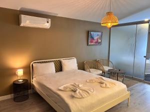 a bedroom with a bed with a blanket on it at Centrum Hotel in Ankara