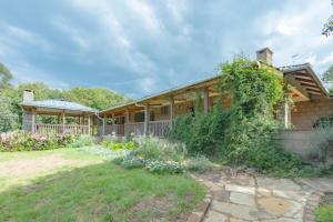 a house with a garden in front of it at Olesamara Collection in Nanyuki