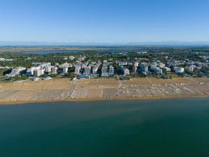 an aerial view of a beach with buildings and the water at Aparthotel Imperial in Bibione +117 photos