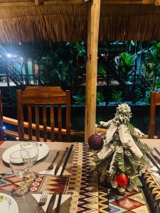 a table with a skeleton sitting on top of it at Phong Nha Mountain House in Vực Trô