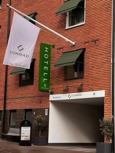 a building with a sign on the side of it at Hotell Conrad in Karlskrona +101 photos