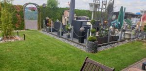 a garden with a bunch of plants in a yard at Ferienwohnung Roersch in Freudenburg +5 photos