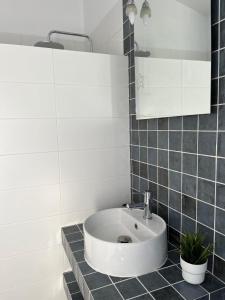 a bathroom with a sink and a mirror at Los Granainos in Arcos de la Frontera +5 photos