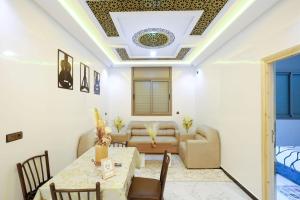 a living room with a coffered ceiling at Riad Bollywood-Star Stay A in Benguerir +7 photos