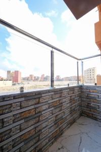 an empty balcony with a view of the city at Riad Bollywood-Star Stay A in Benguerir