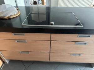 a black counter with a tv on top of a dresser at Antwerp West Side, Fireplace in Zwijndrecht +6 photos