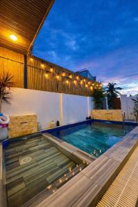 a swimming pool on top of a building at Doc Bien Homestay Mui Ne - Entire Home in Ấp Khánh Phước (1)