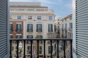 a view of a building from a balcony at Apartamentos Calle Larios in Málaga
