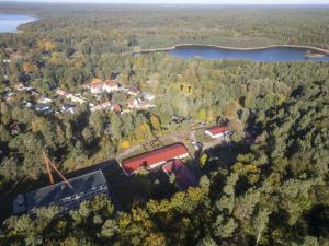 an aerial view of a house in the middle of a forest at Pension Stechlinsee in Neuglobsow