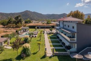 an aerial view of a building with a garden at A Ponte Studios & Apartments in Sykia Chalkidikis +30 photos
