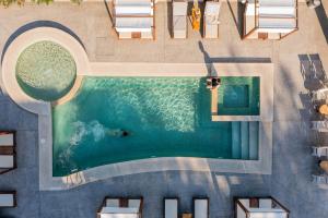 an overhead view of a swimming pool in a resort at A Ponte Studios & Apartments in Sykia Chalkidikis