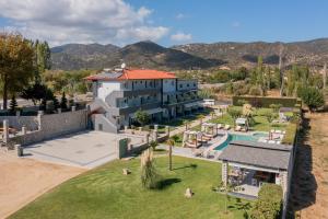 an aerial view of a house with a swimming pool at A Ponte Studios & Apartments in Sykia Chalkidikis