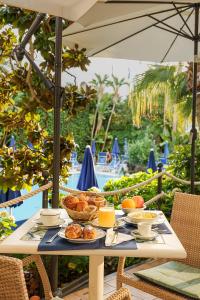 a table with plates of food on top of it at Hotel Floridiana Terme in Ischia Town