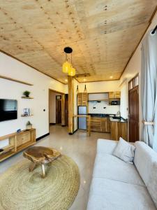 a living room with a couch and a table at JND Cozy Homes in Iringa