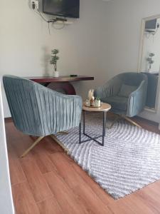 a living room with a couch and a table at Emangweni Guest House in Vryheid