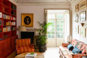 a living room with a couch and a table at Convento de Cabanas in Viana do Castelo