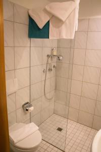 a bathroom with a shower and a toilet at Hotel Gerberhaus in Rothenburg ob der Tauber +38 photos