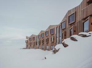 a row of buildings in the snow at Highland Base Kerlingarfjöll in Kerlingarfjoll