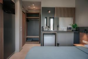 a kitchen with a sink and a counter top at Elizabeth Queen Luxury Rooms in Paralia Katerinis