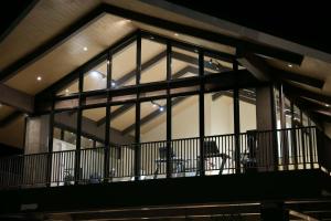 a building with large windows with a table and chairs at Lolit cozy condo in Lapu Lapu City