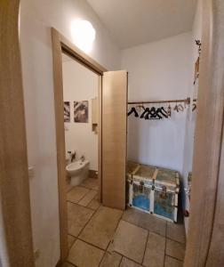a bathroom with a toilet and a sink at B & B Stella Marina in Taranto