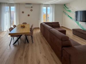 a living room with a couch and a table at Casa Lo Bianco in Terrasini