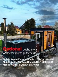 a tiny house is parked in a parking lot at Ölschnitzer Loft in Lampertswalde