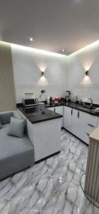 a kitchen with a couch and a counter in a room at Casa españa LUXURY in Tangier