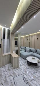 a living room with a couch and a table in it at Casa españa LUXURY in Tangier