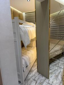 a room with two bunk beds and a mirror at Casa españa LUXURY in Tangier