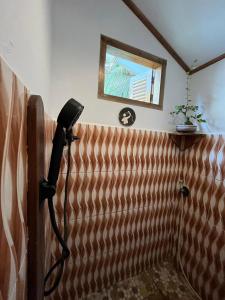 a phone on a wall in a room at In Home stay in Bulakbenda