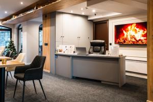an office with a fire on the wall at Apart Hotel Dream in Bansko